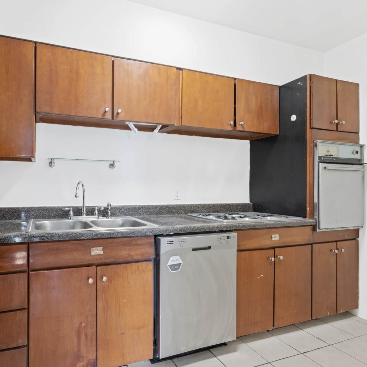 Kitchen with dishwasher at Central Gardens Apartments